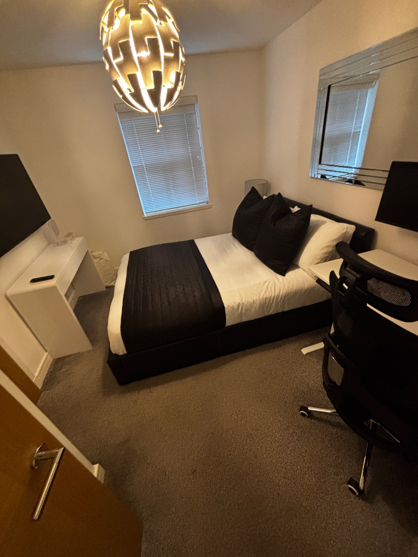 Bedroom after a NordSpark clean — crisp bedding and hoovered carpet