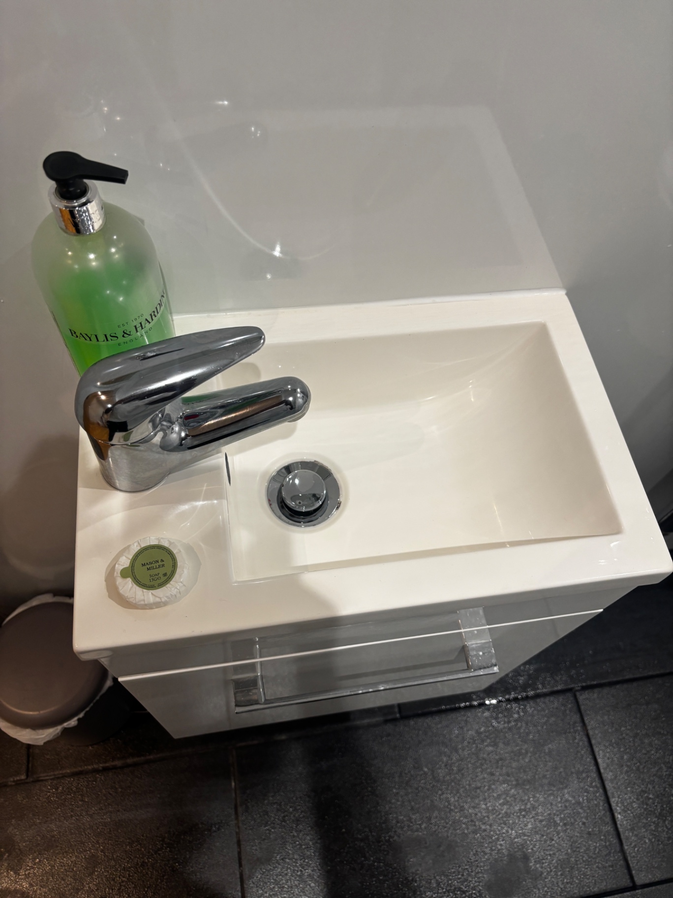 Bathroom basin and tap polished after a NordSpark clean